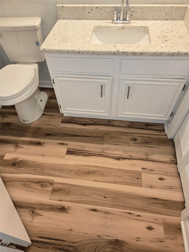 107 Malibu Dr, Shreveport, LA 71115 - bathroom with toilet, wood finished floors, and vanity