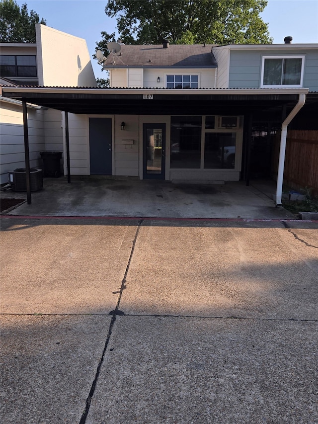 view of front of home with a carport