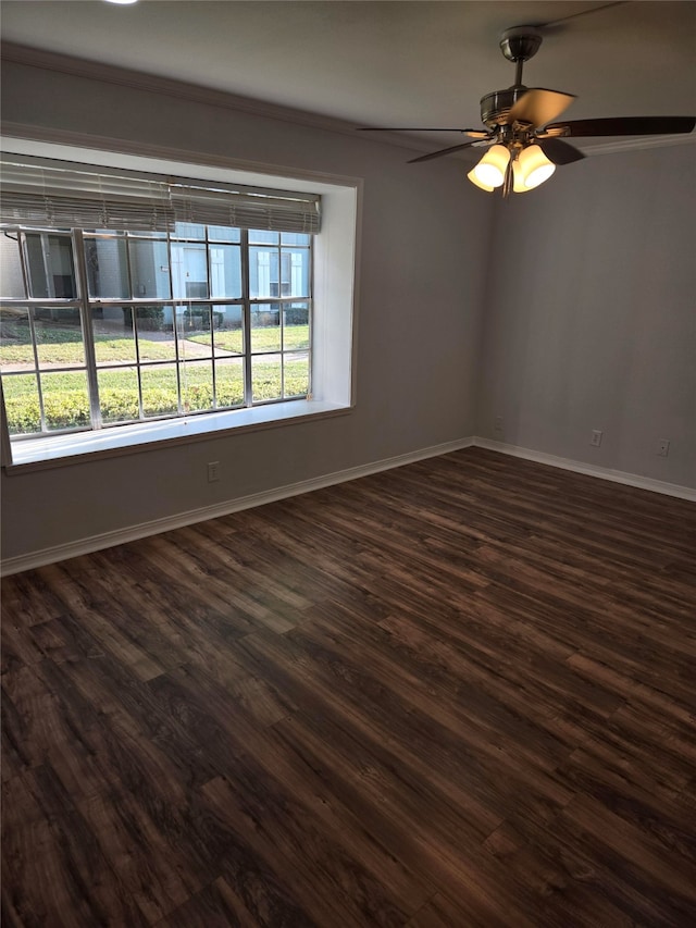 unfurnished room with ornamental molding, dark hardwood / wood-style floors, and ceiling fan