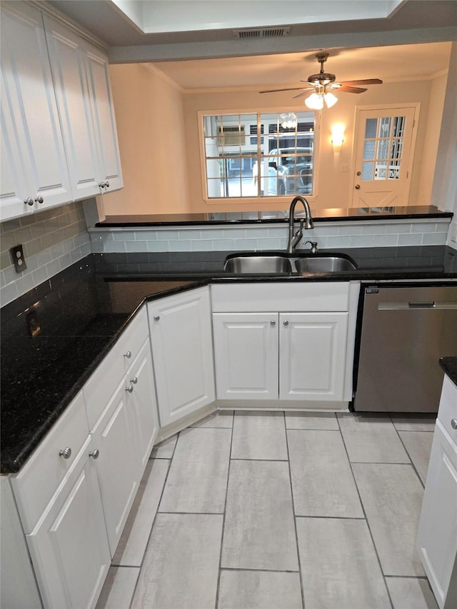 107 Malibu Dr, Shreveport, LA 71115 - kitchen featuring dishwasher, ceiling fan, white cabinetry, a sink, and backsplash