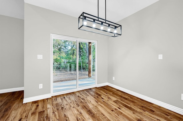 unfurnished dining area with hardwood / wood-style floors