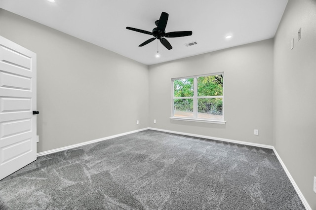 unfurnished room with carpet flooring and ceiling fan