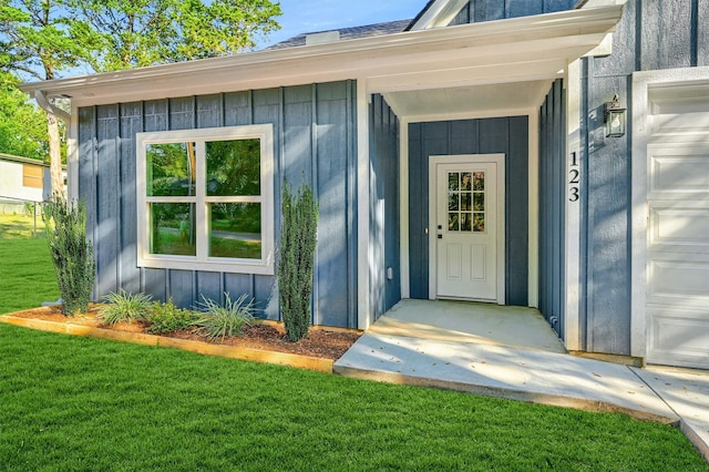 property entrance with a yard