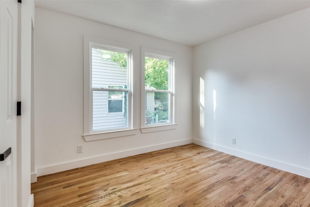 927 S Franklin St, Dallas, TX 75211 - spare room featuring light wood-style flooring and baseboards