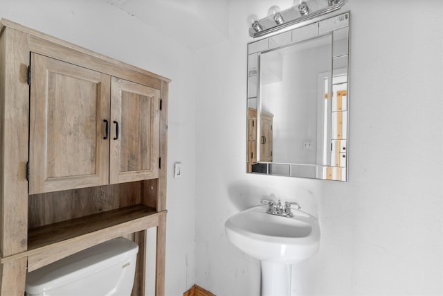 bathroom featuring sink and toilet