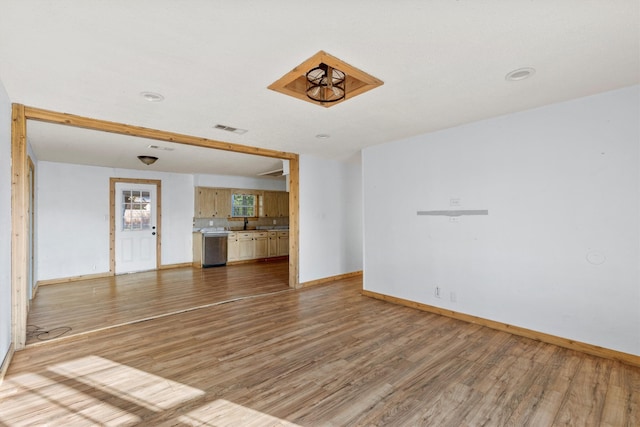 unfurnished living room with hardwood / wood-style flooring