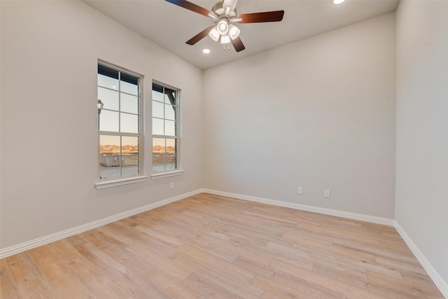 unfurnished room featuring ceiling fan and light hardwood / wood-style flooring