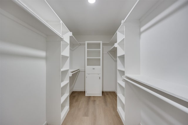 spacious closet featuring light hardwood / wood-style floors