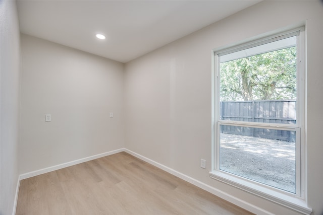 unfurnished room with light wood-type flooring