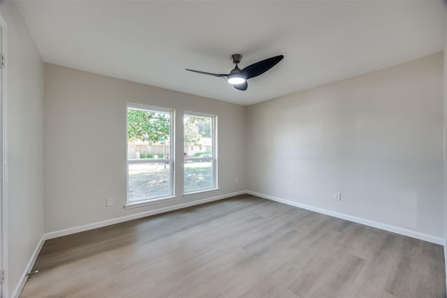 spare room with ceiling fan and light hardwood / wood-style flooring