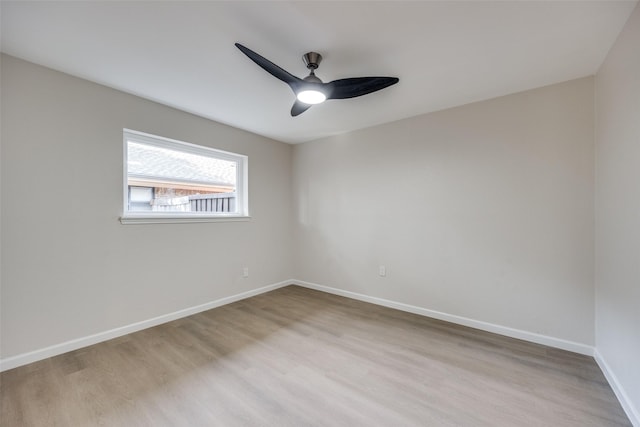 spare room featuring ceiling fan and light hardwood / wood-style flooring