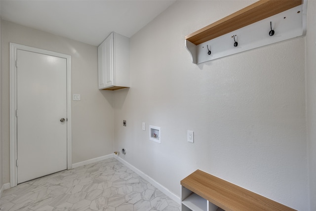 clothes washing area with cabinets, hookup for an electric dryer, gas dryer hookup, and hookup for a washing machine