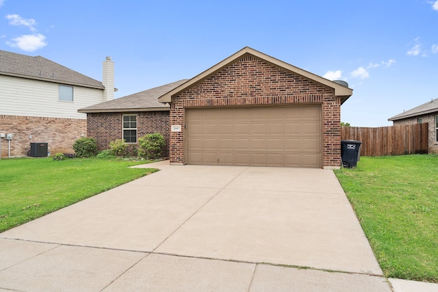 view of front of property featuring a garage, cooling unit, and a front lawn