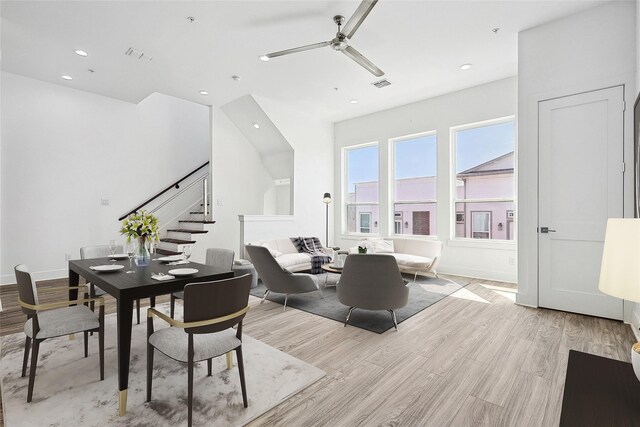 kitchen featuring sink, hanging light fixtures, dark wood-type flooring, stainless steel appliances, and a kitchen island with sink