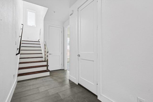 stairs with tile patterned flooring