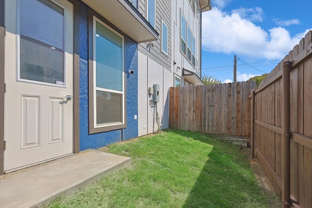 view of yard with a fenced backyard