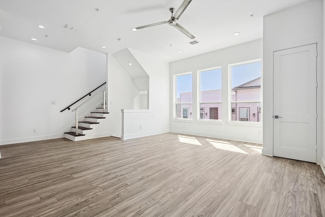 unfurnished living room featuring light wood finished floors, recessed lighting, visible vents, ceiling fan, and stairs