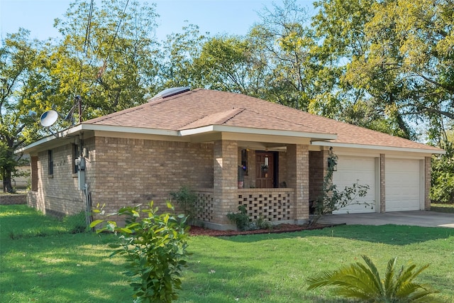 ranch-style home with a garage and a front lawn