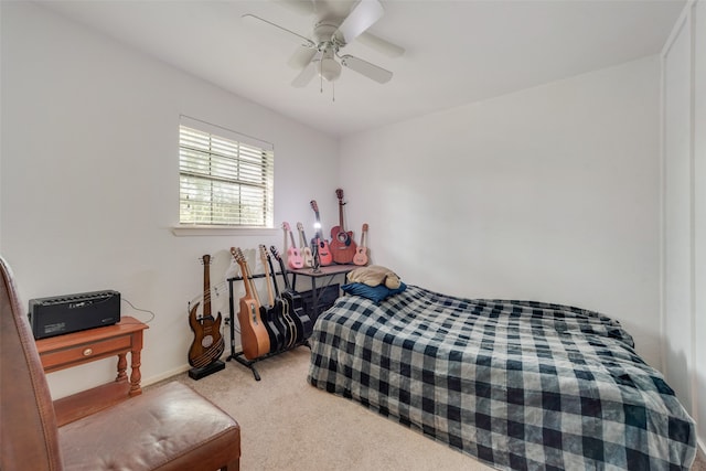 bedroom with ceiling fan and carpet flooring