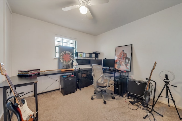 home office with ceiling fan and carpet