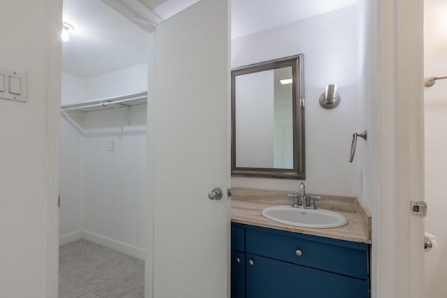 bathroom with tile patterned floors and vanity