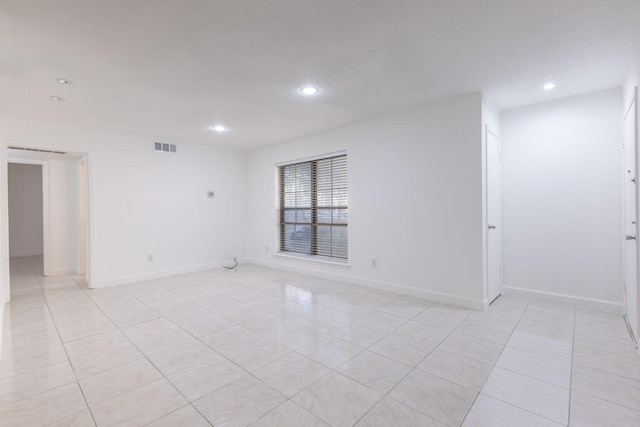 empty room featuring light tile patterned floors