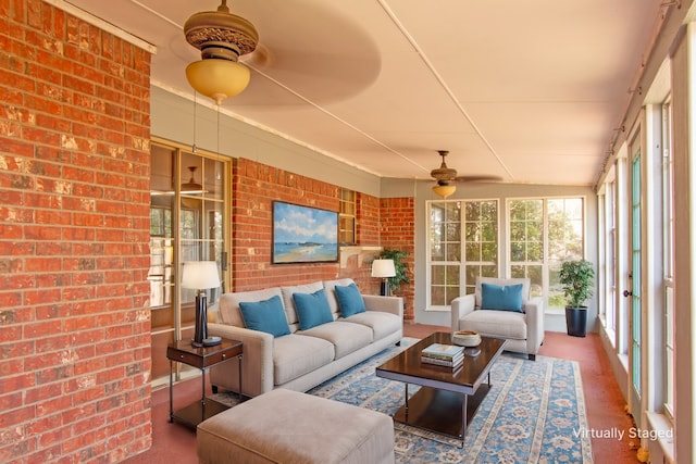 sunroom with vaulted ceiling and ceiling fan