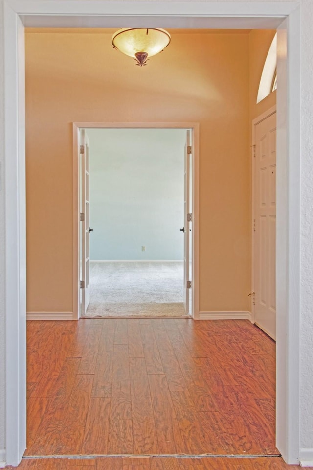 hallway featuring hardwood / wood-style flooring