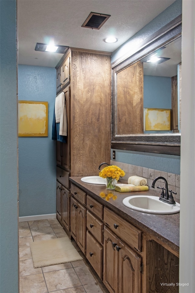 bathroom with decorative backsplash and vanity