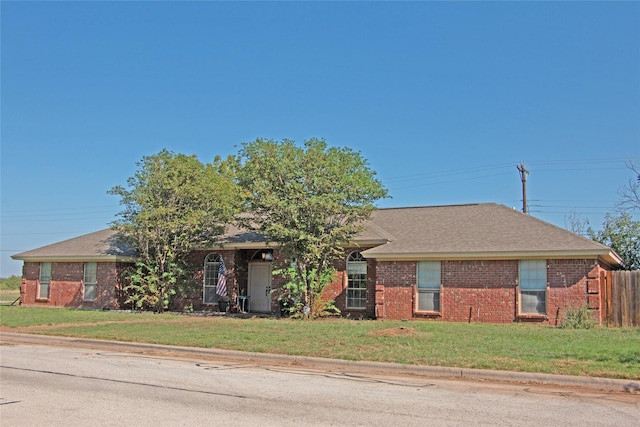 ranch-style house with a front lawn