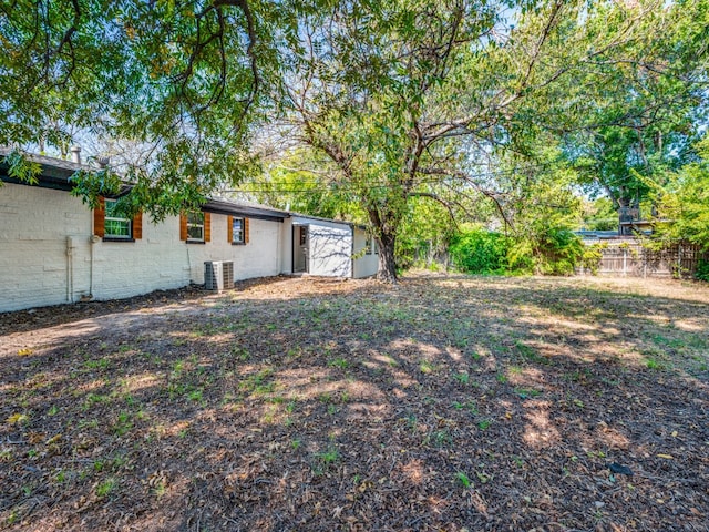 view of yard with central AC