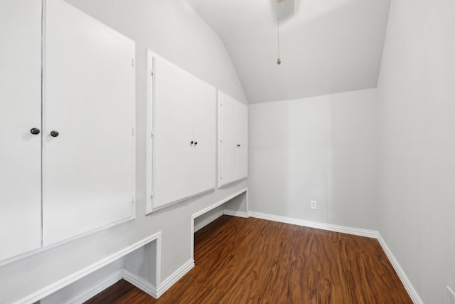 mudroom featuring lofted ceiling, wood finished floors, and baseboards