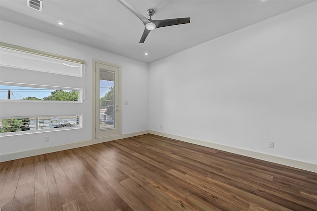 spare room featuring wood-type flooring and ceiling fan