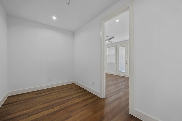 spare room with dark hardwood / wood-style floors