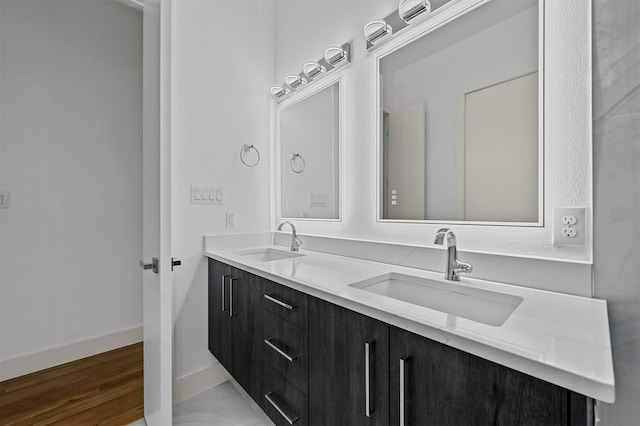 bathroom featuring hardwood / wood-style flooring and vanity