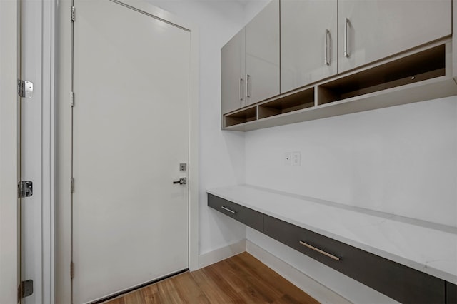 mudroom with dark hardwood / wood-style flooring