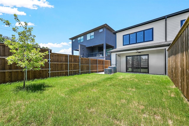 back of house with a lawn