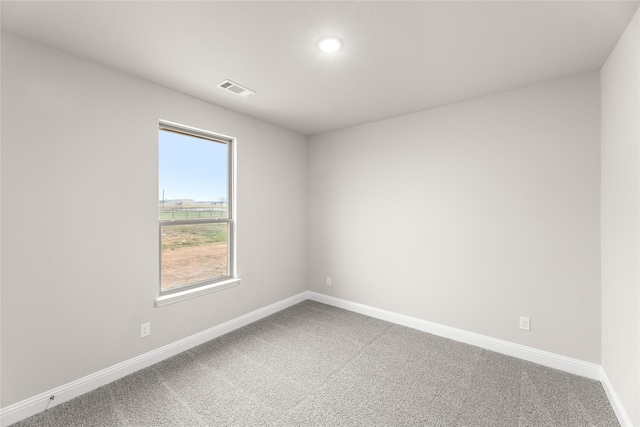 empty room with carpet flooring