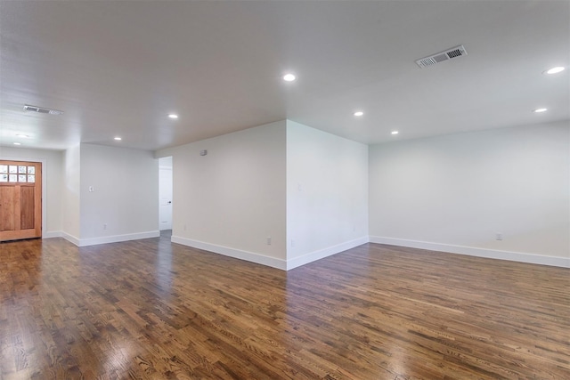 empty room featuring dark wood-type flooring