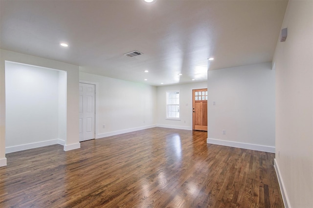 spare room with dark hardwood / wood-style flooring