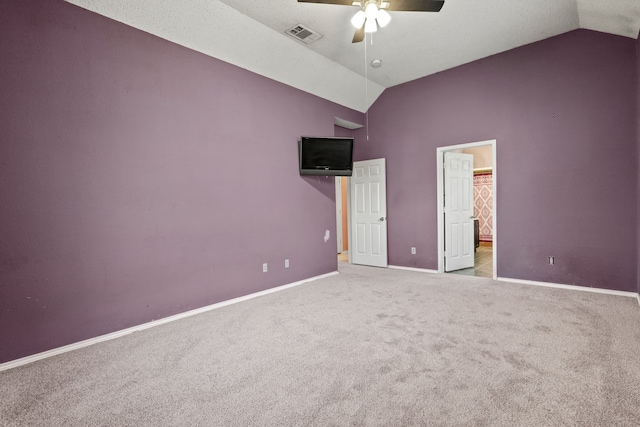 unfurnished bedroom featuring ceiling fan, light colored carpet, and vaulted ceiling