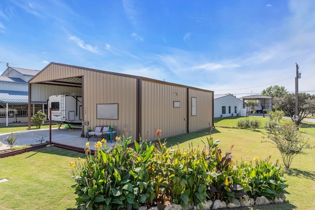 view of outbuilding with a lawn