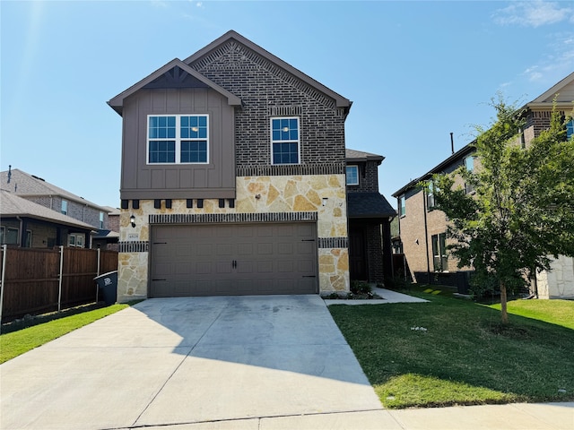 view of front of house featuring a front yard and a garage