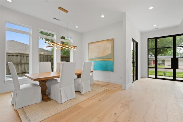 dining area with light wood-type flooring