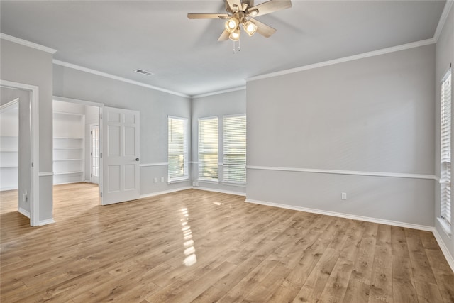 empty room featuring ornamental molding, light hardwood / wood-style flooring, and ceiling fan