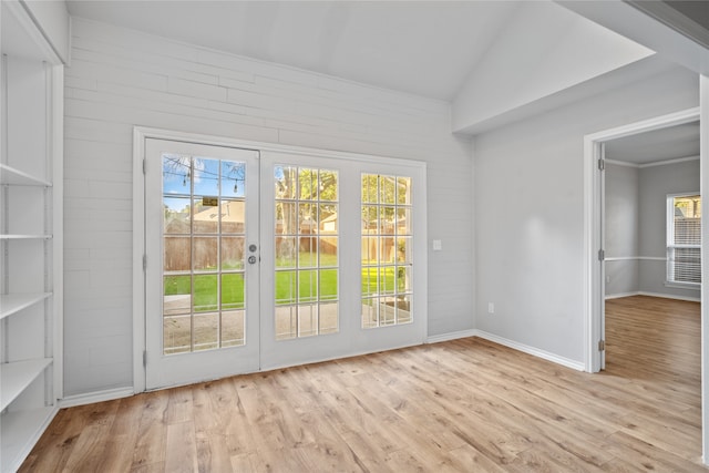 doorway featuring french doors, light hardwood / wood-style flooring, and plenty of natural light