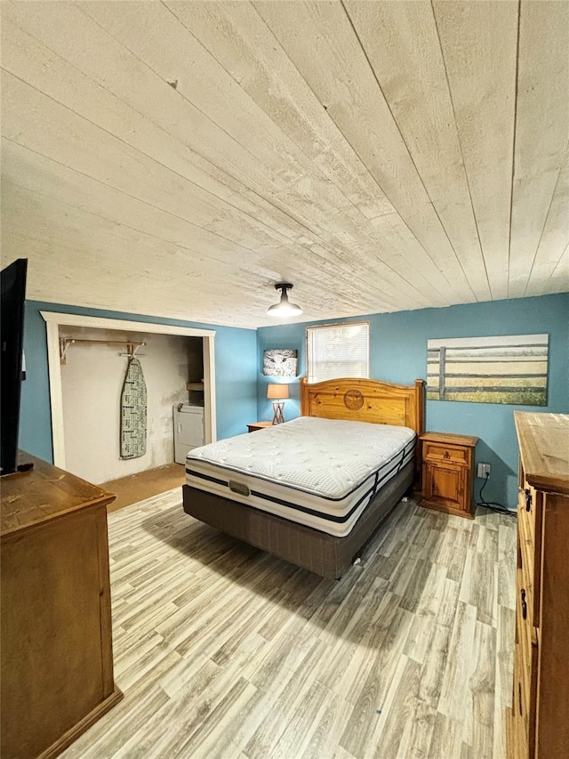 bedroom featuring wooden ceiling and light wood-type flooring