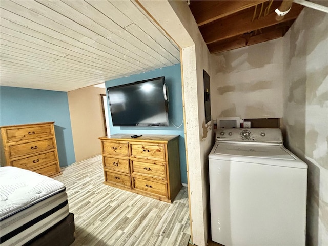 interior space with washer / clothes dryer and light hardwood / wood-style flooring