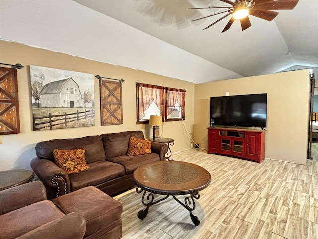 living room featuring lofted ceiling, ceiling fan, and light hardwood / wood-style flooring