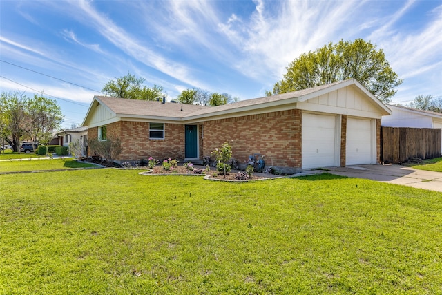 ranch-style house featuring a garage and a front lawn